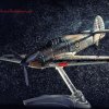 Model Supermarine Spitfire flying though bad weather