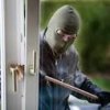 Burglar stuck under door for nine hours
