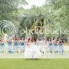 අමුතුම තාලේ “කික්”  එකක් තියෙන ලෝක ප්‍රසිද්ධ මංගල ඡායාරූපය - Dinosaur Wedding Photo: T-Rex Chases Bridal Party !!